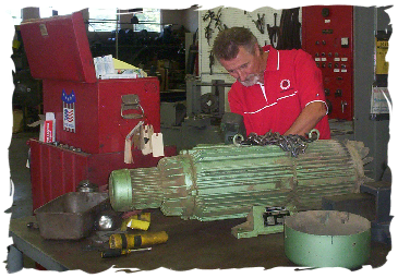 photo of Denny Fenton working on a motor